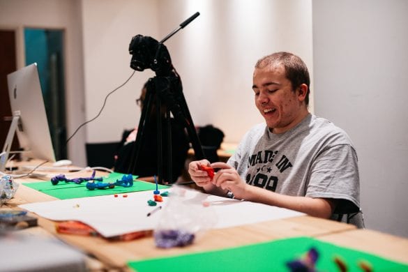 Member of the Mouth That Roars organisation creating models for their animation
